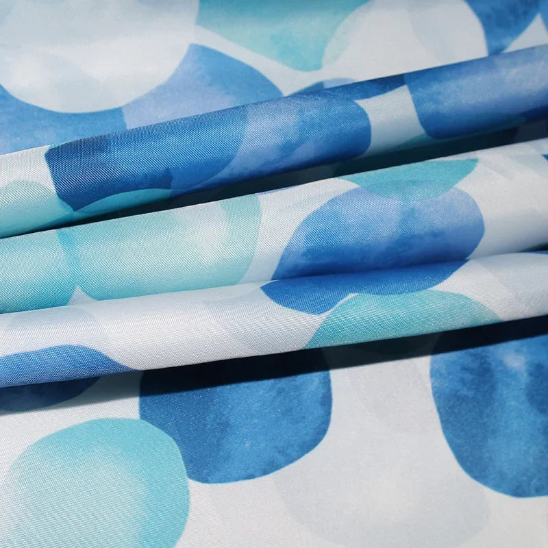 Fabric shower curtain with plastic hooks - SplashDot